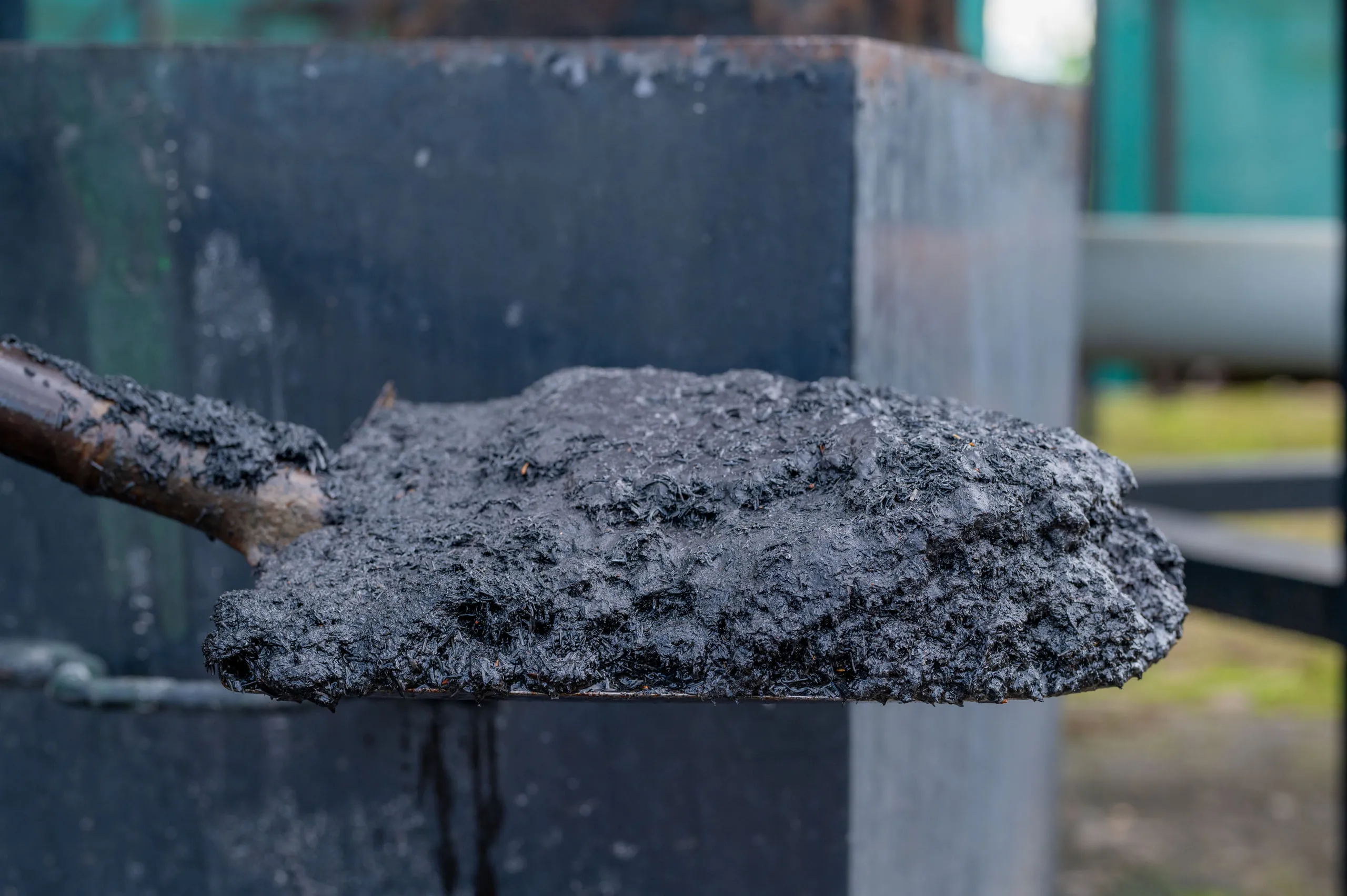 A shovel of biochar drawn from the gasifier at Got Ngur